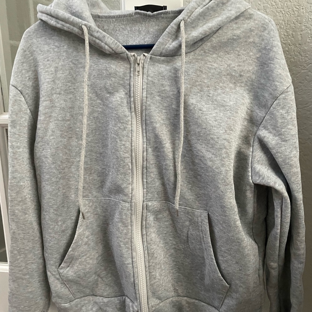 One Shein zip hoodie and one American Eagle crop sweatshirt